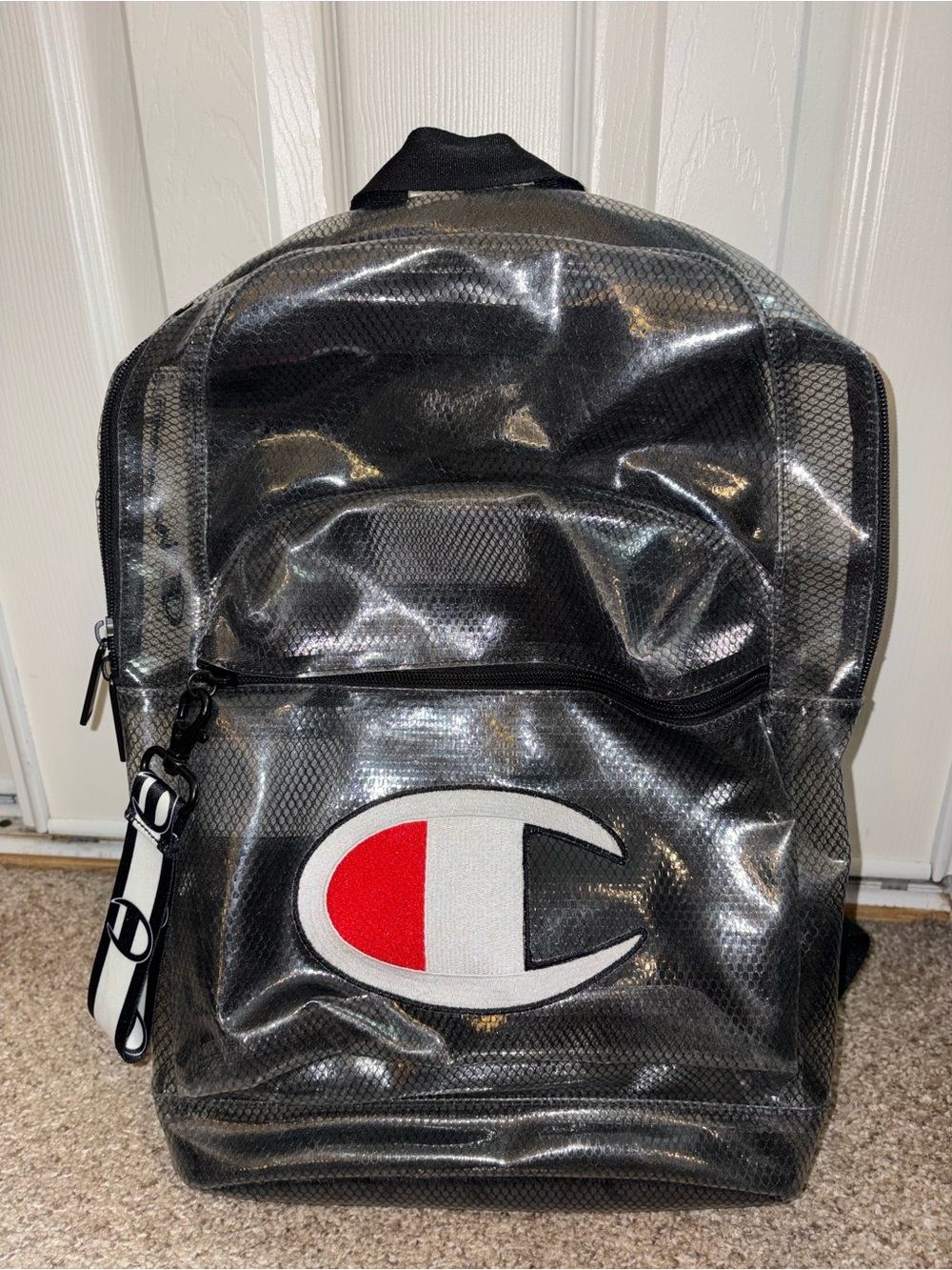 Champion Black Vinyl Backpack with Red & White Logo Patch
